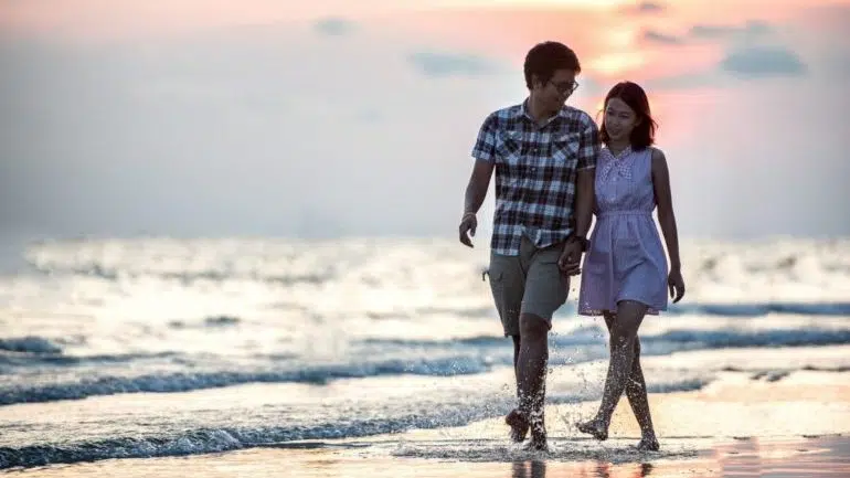 A couple walking on the beach