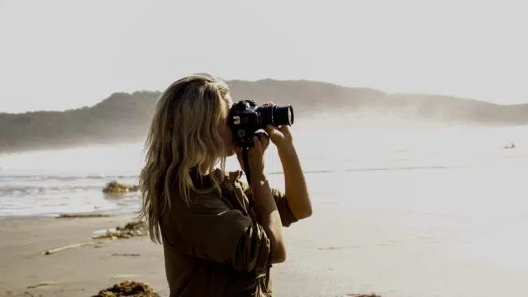 A photographer on the beach